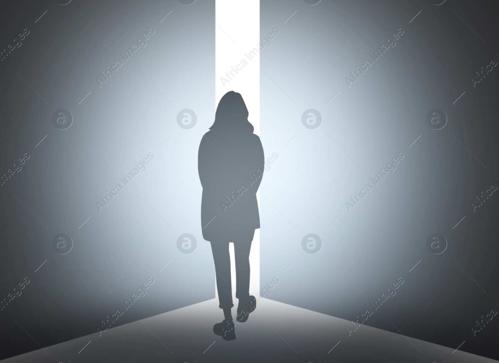 Image of Silhouette of woman standing in front of light hole, back view