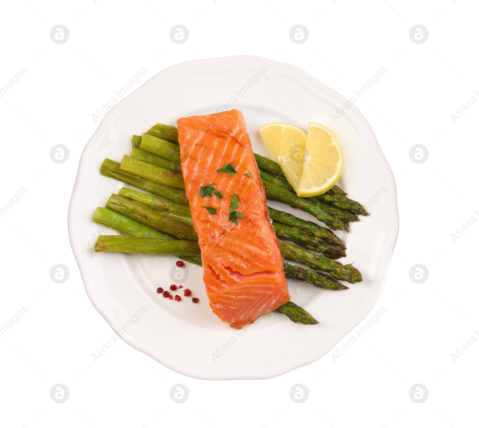 Photo of Tasty grilled salmon with asparagus and lemon isolated on white, top view