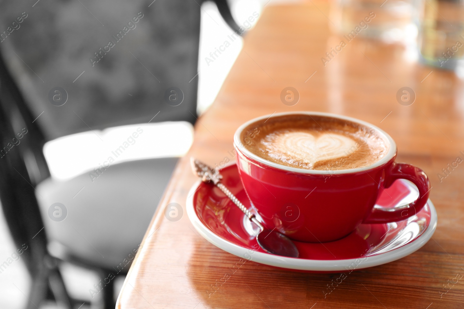 Photo of Cup of fresh aromatic coffee on table