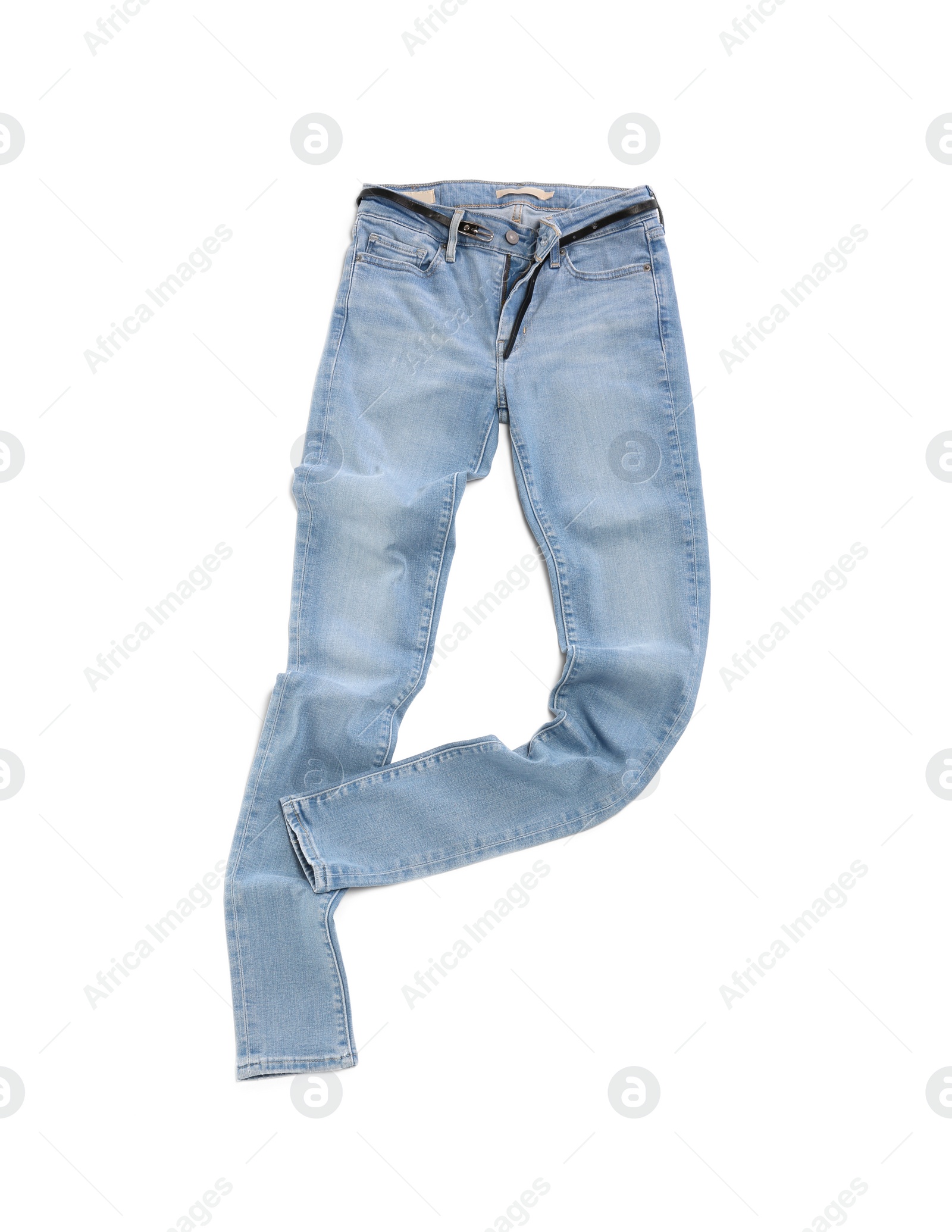 Photo of Stylish light blue jeans isolated on white, top view