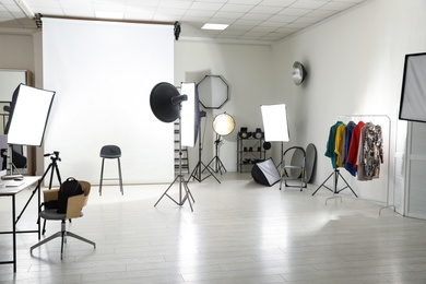 Photo of Interior of modern photo studio with professional equipment