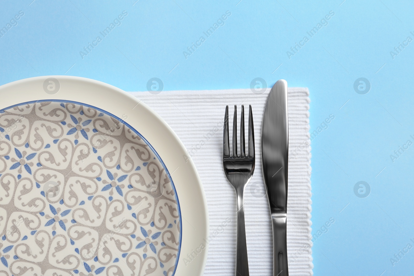 Photo of Stylish elegant table setting on color background, top view