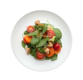 Photo of Delicious fresh chicken salad with vegetables and spinach isolated on white, top view