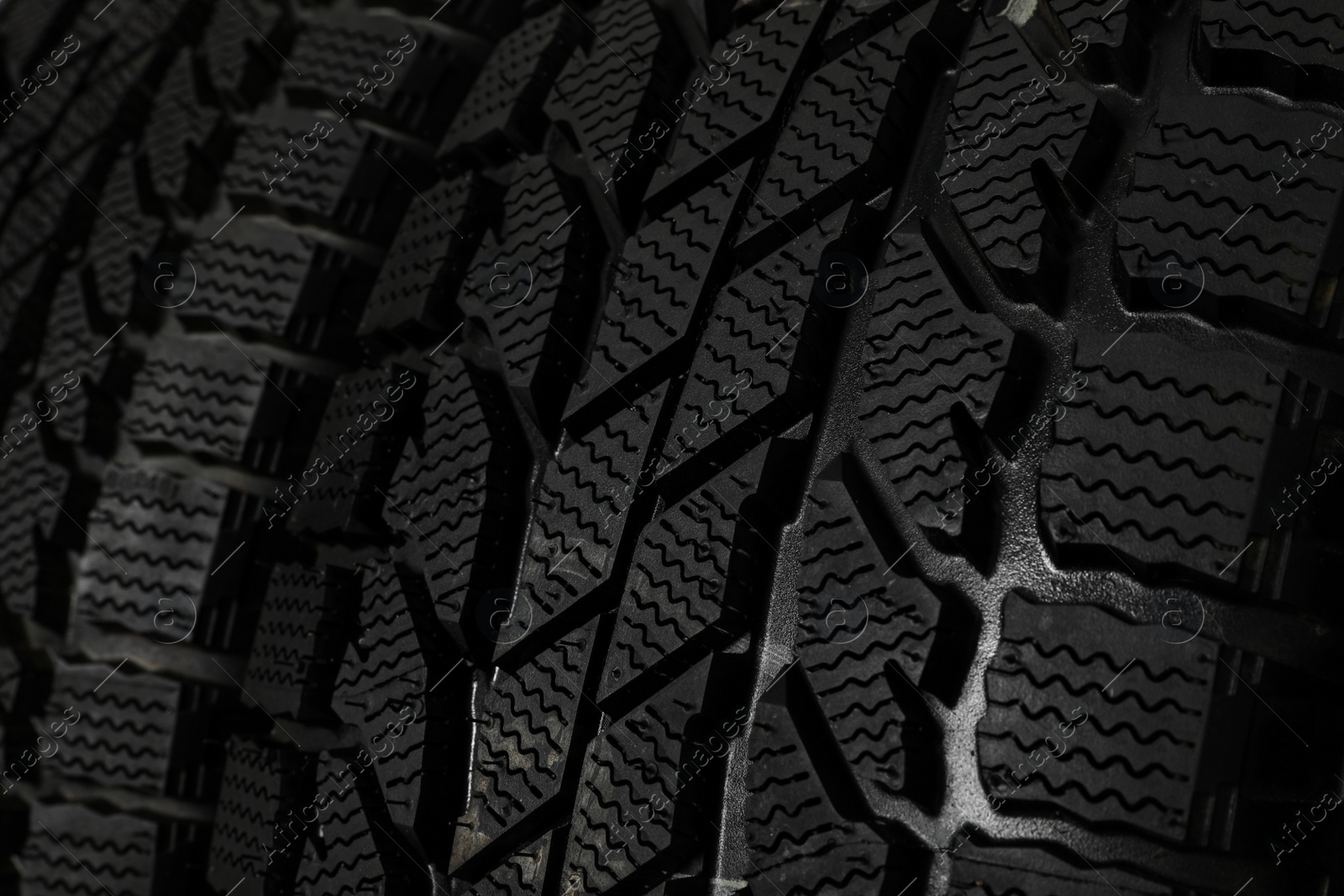 Photo of Set of new winter tires as background, closeup