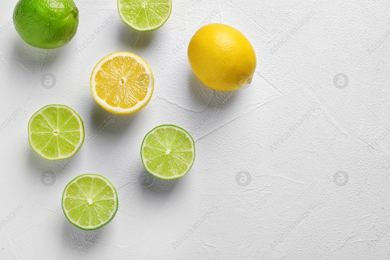Photo of Flat lay composition with fresh citrus fruits on light background