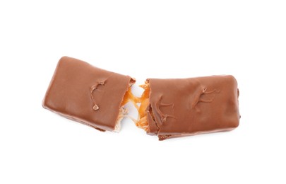 Photo of Broken chocolate bar with caramel, nuts and nougat isolated on white, top view