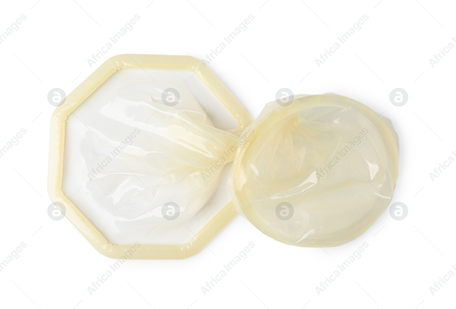 Photo of Unrolled female condom isolated on white, top view. Safe sex