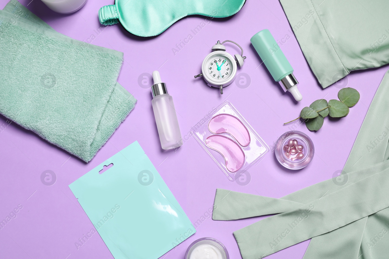 Photo of Flat lay composition with sleeping mask and skin care products on violet background