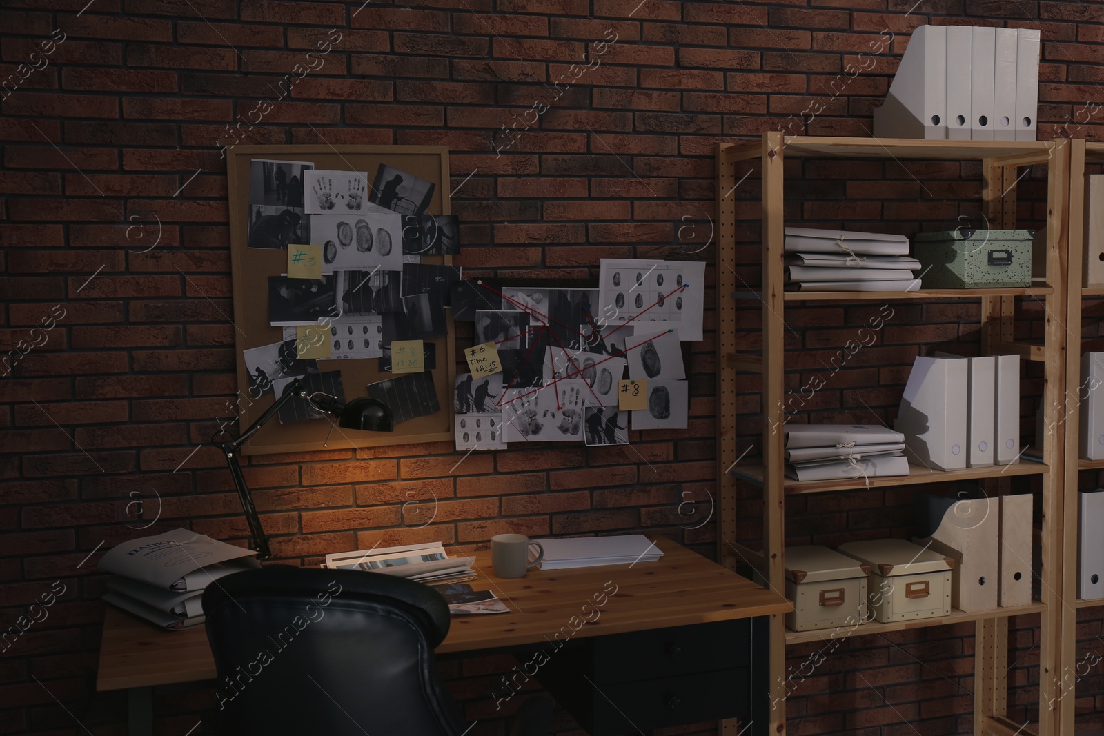 Photo of Detective workplace near brick wall in office