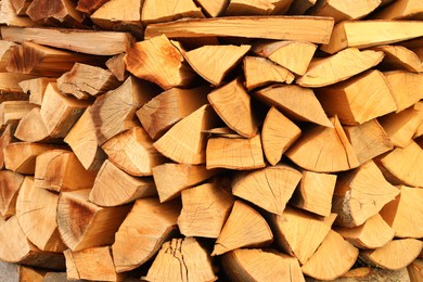 Stack of chopped firewood as background, closeup