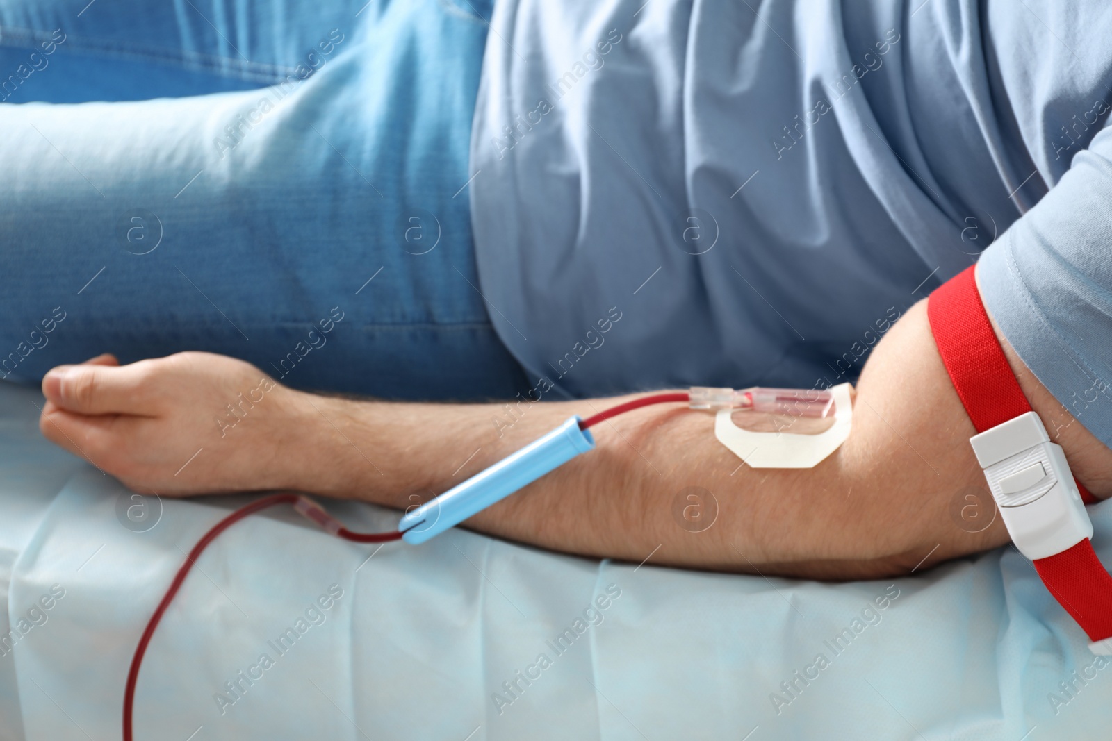 Photo of Man donating blood to save someone's life in hospital