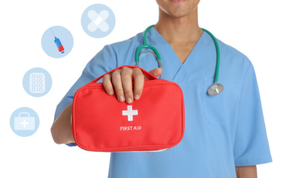 Doctor holding first aid kit on white background, closeup. Medical service