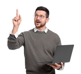 Photo of Handsome bearded businessman with laptop pointing at something on white background