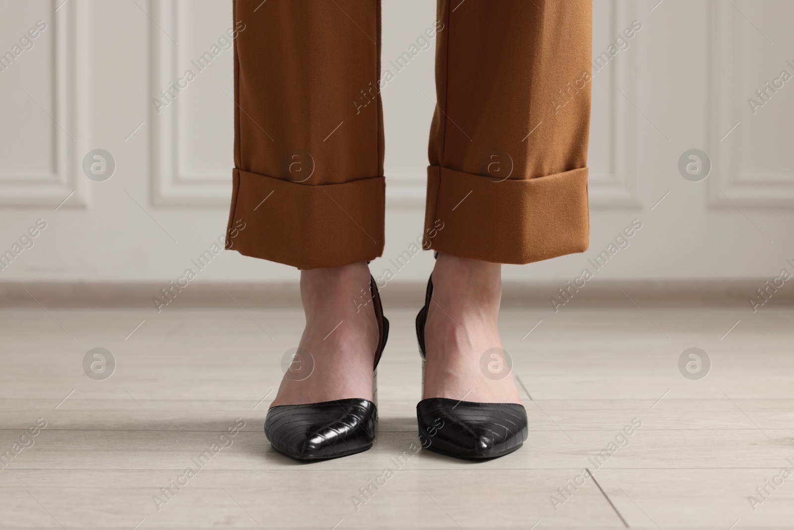 Photo of Businesswoman in elegant leather shoes indoors, closeup