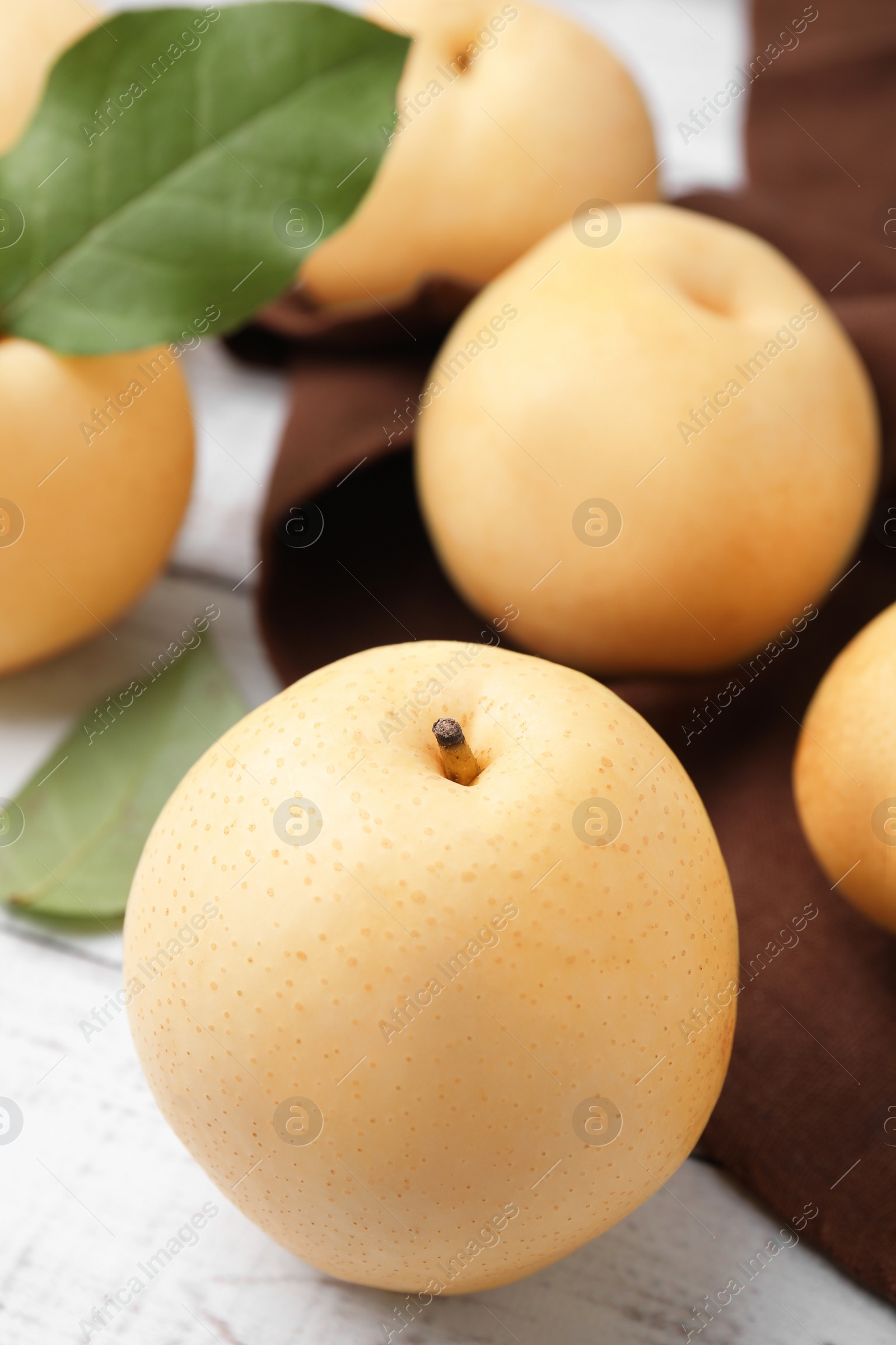 Photo of Delicious apple pears on white wooden table, closeup