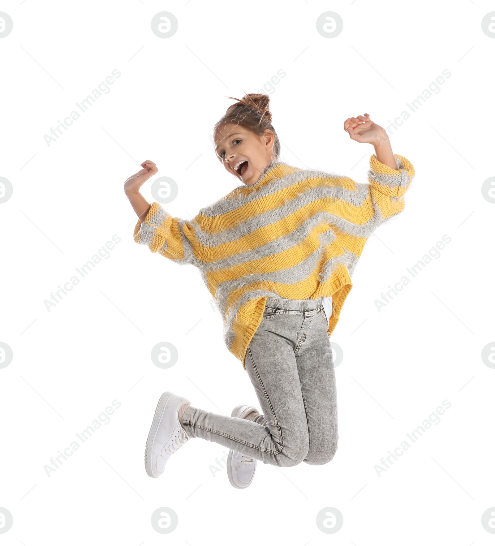 Photo of Pretty emotional preteen girl jumping against white background