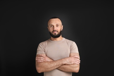 Photo of Portrait of handsome man on black background