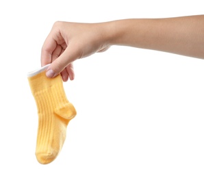 Woman holding cute child sock on white background, closeup