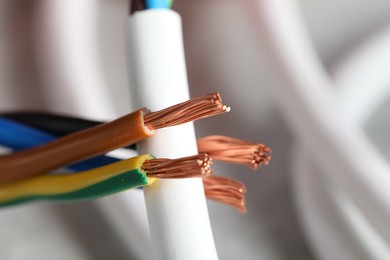 Photo of Colorful electrical wire on blurred background, closeup