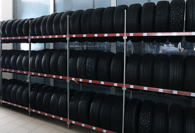 Car tires on rack in auto store