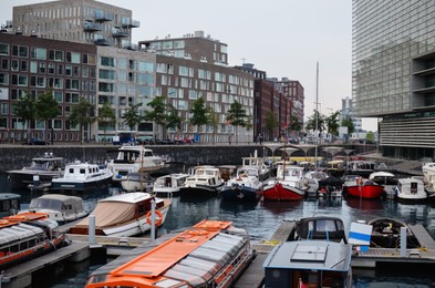 Beautiful view of cityscape with boats on river