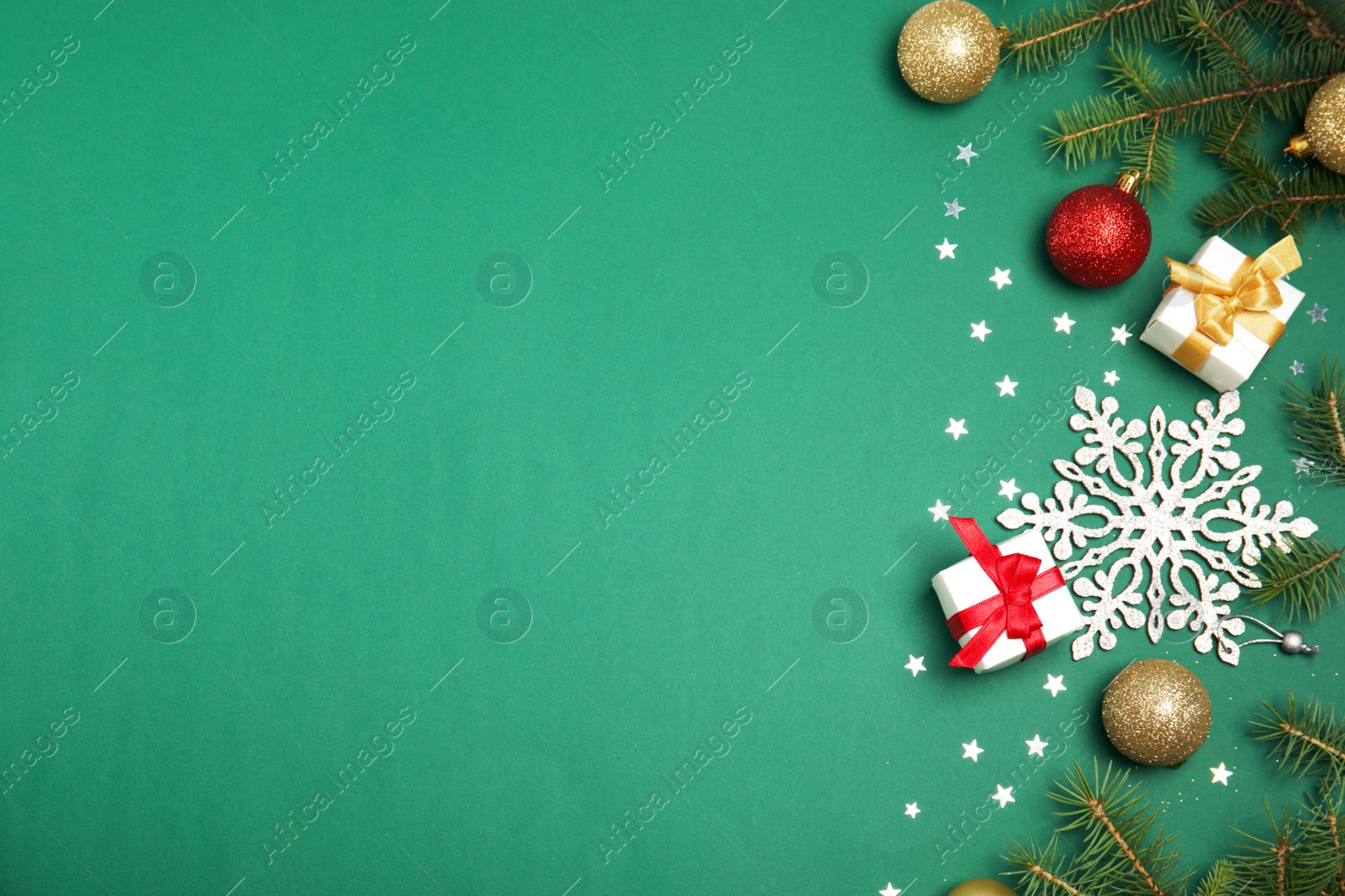 Photo of Flat lay composition with Christmas tree branches and festive decor on color background