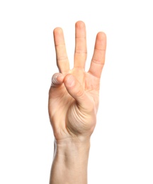 Photo of Man showing number six on white background, closeup. Sign language