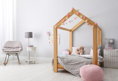 Stylish child room interior with comfortable bed