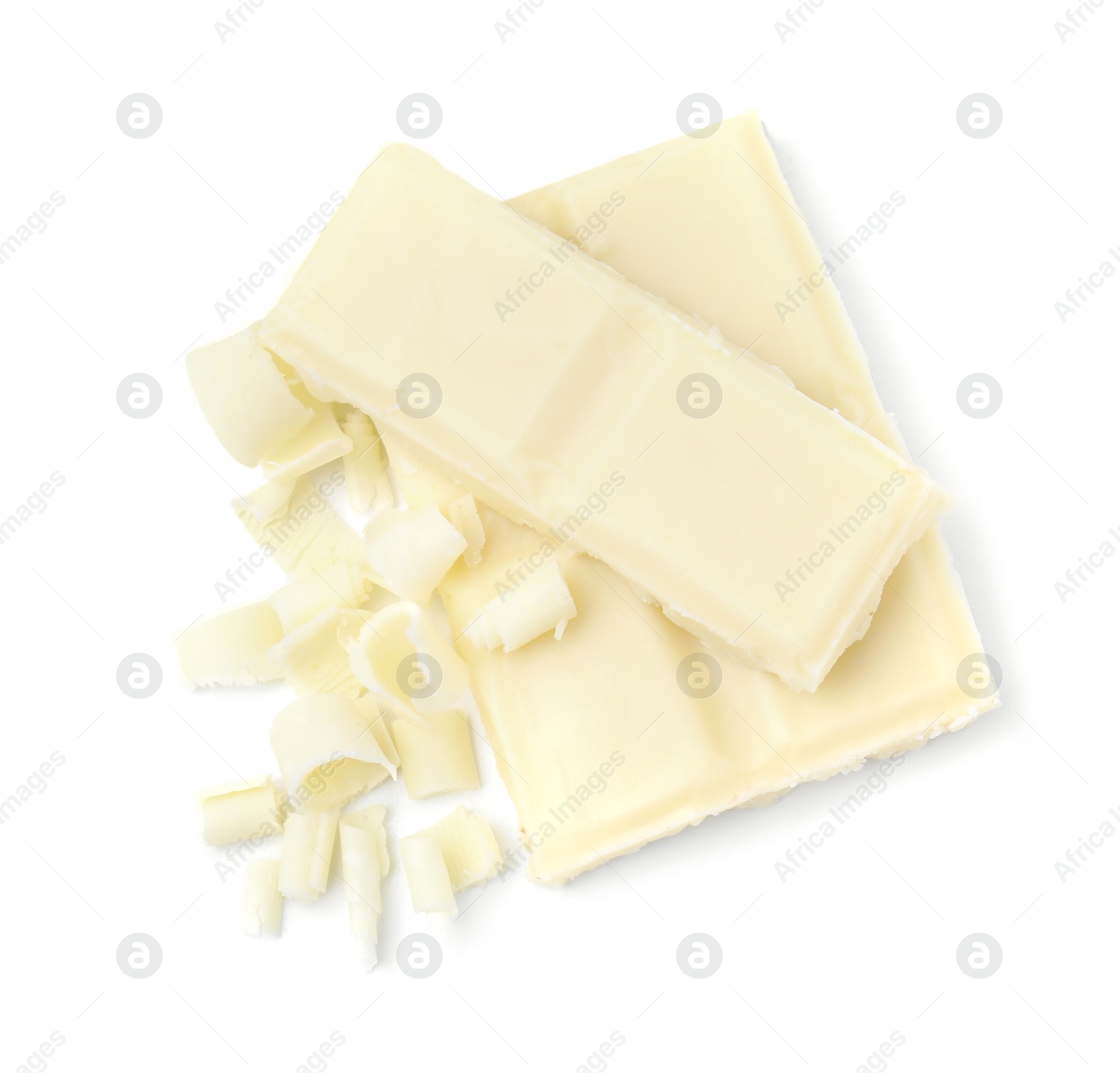 Photo of Pieces of tasty chocolate bar and shavings isolated on white, top view