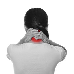 Woman suffering from rheumatism on white background. Black and white effect with red accent in painful area