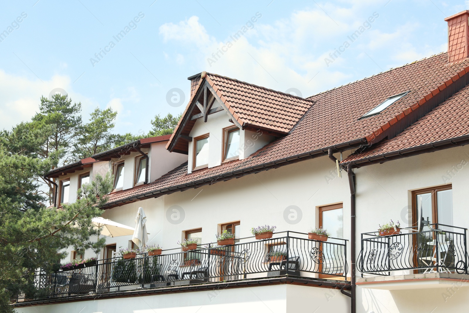 Photo of View of house with balconies. Modern exterior