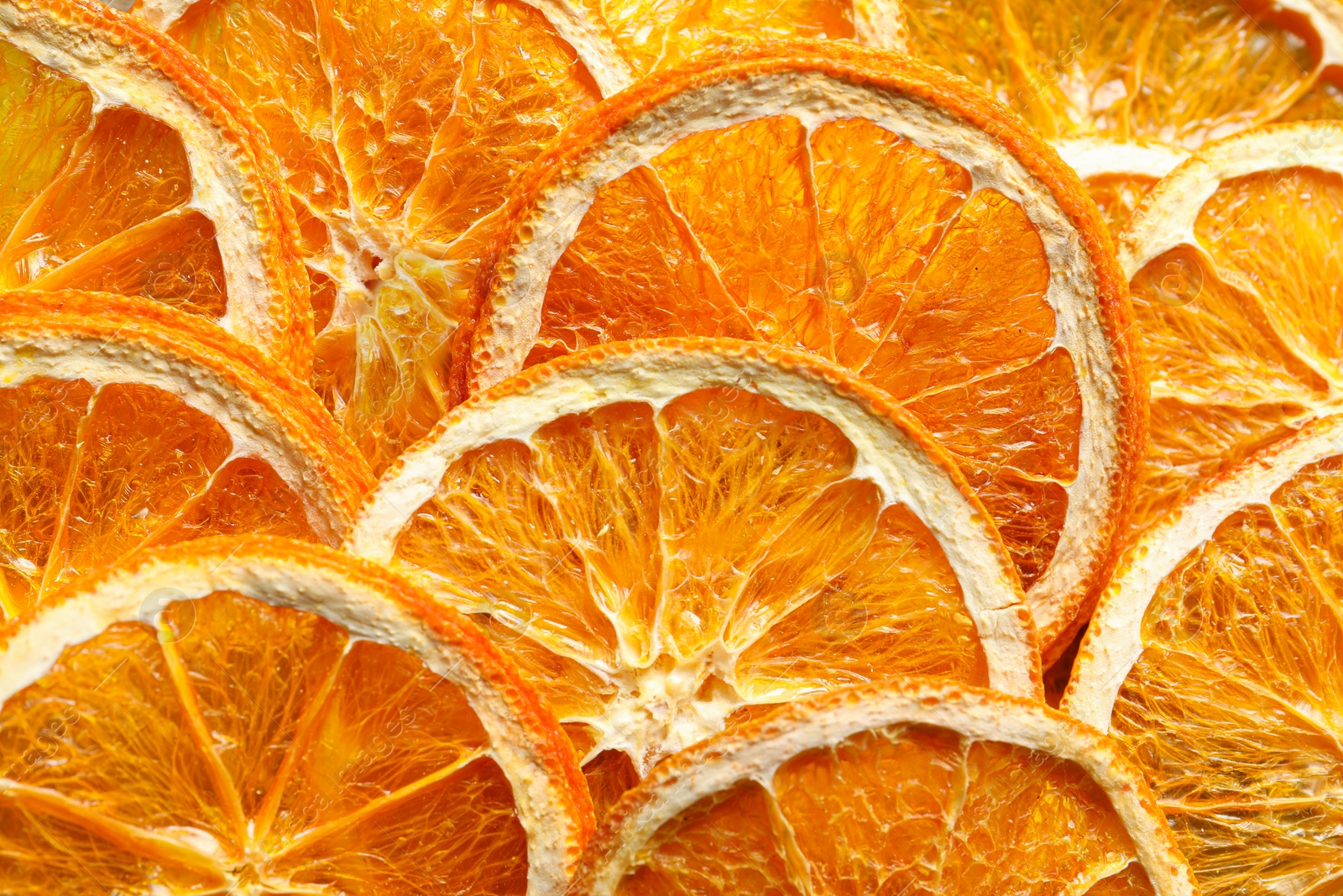 Photo of Many dry orange slices as background, closeup