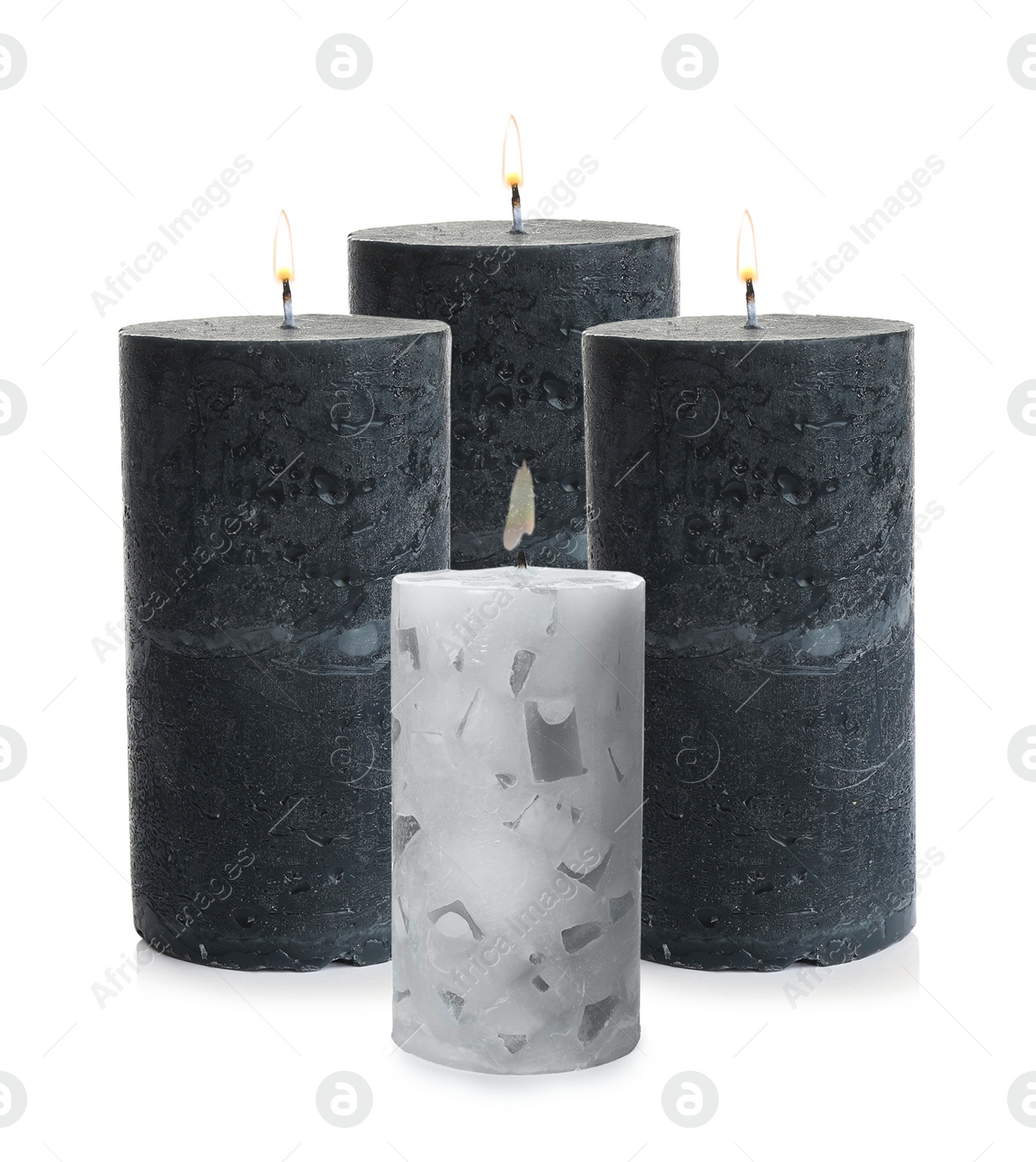 Image of Set of burning color candles on white background