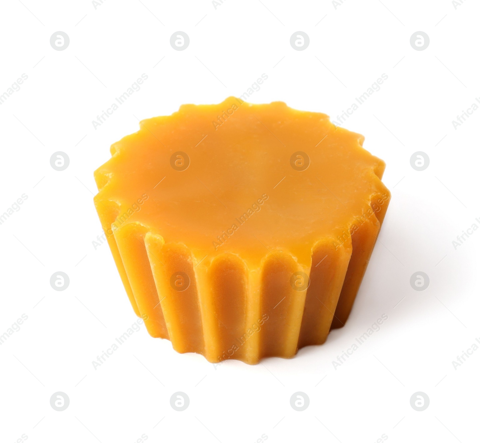 Photo of Natural beeswax cake block isolated on white