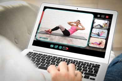 Image of Personal trainer online. Man viewing website via laptop at home, closeup