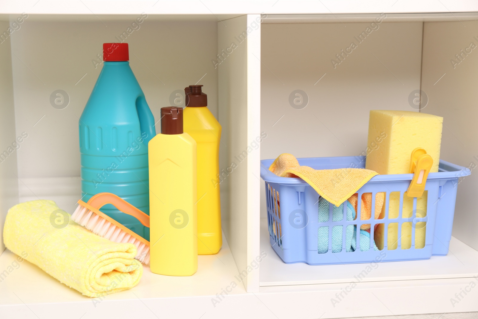 Photo of Different cleaning supplies and tools on shelves