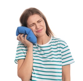 Young woman suffering from toothache on white background