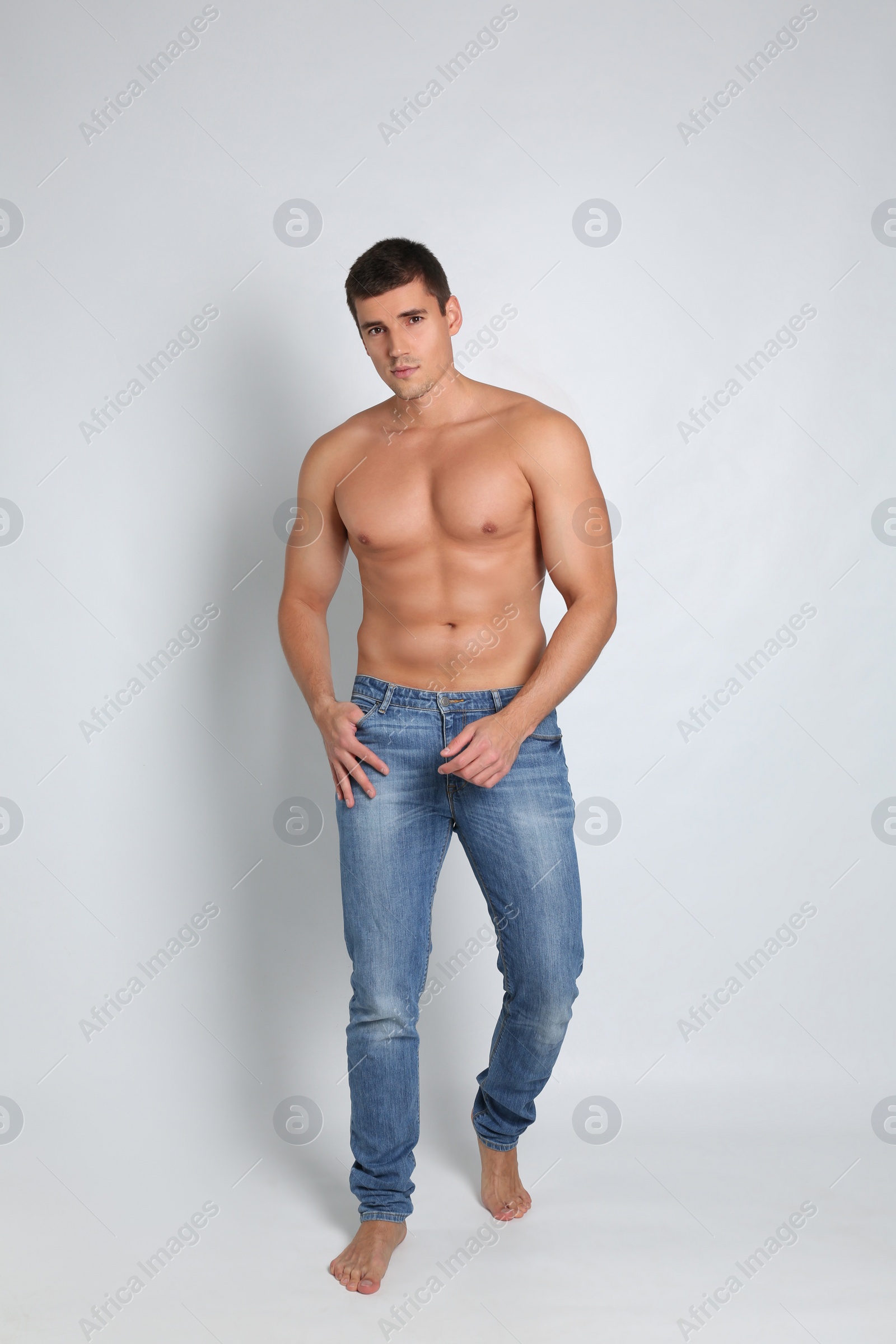 Photo of Man with sexy body on light background