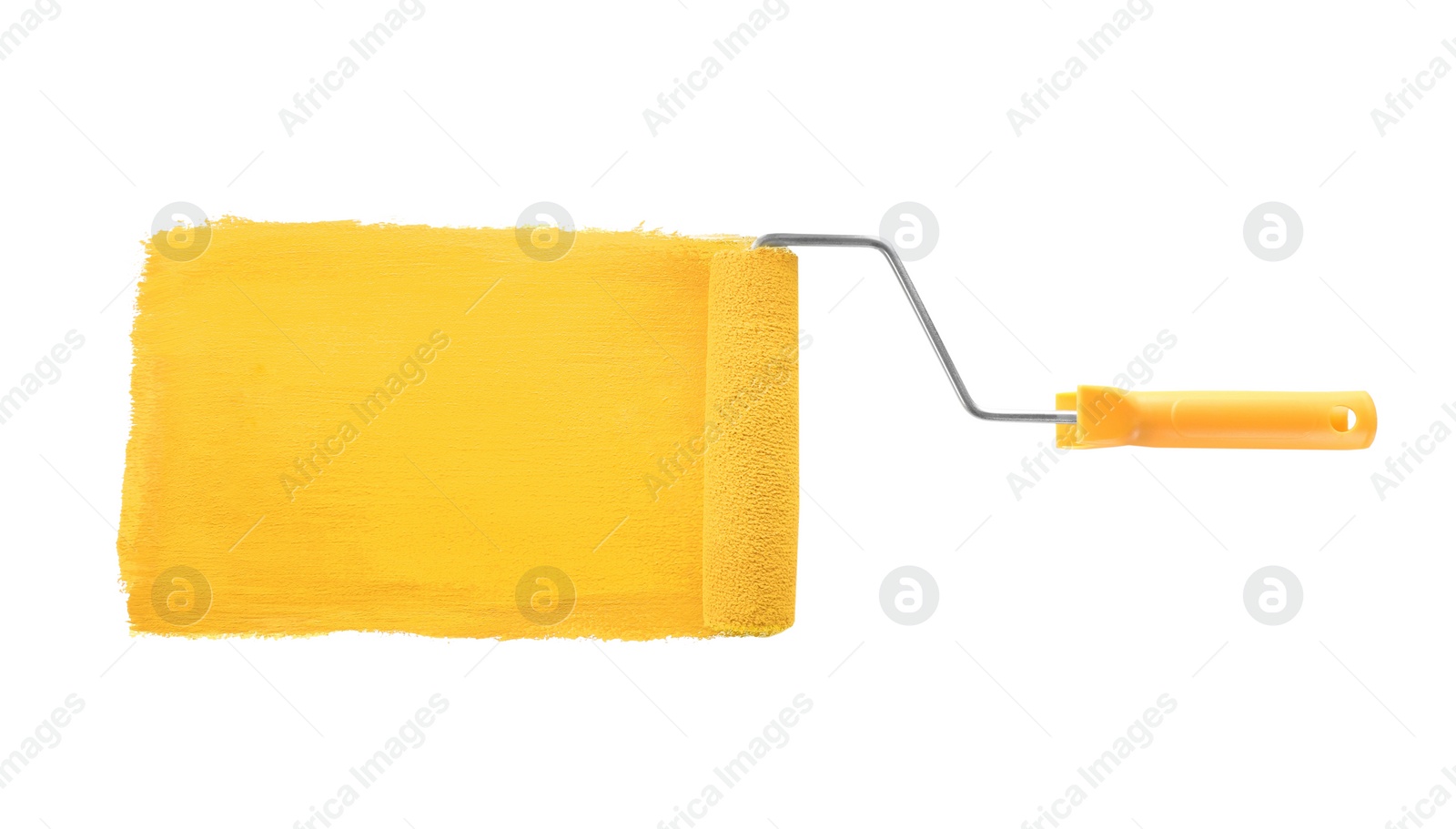 Photo of Applying coral paint with roller brush on white background, top view