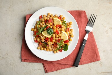 Photo of Delicious fresh chickpea salad on light grey table, flat lay