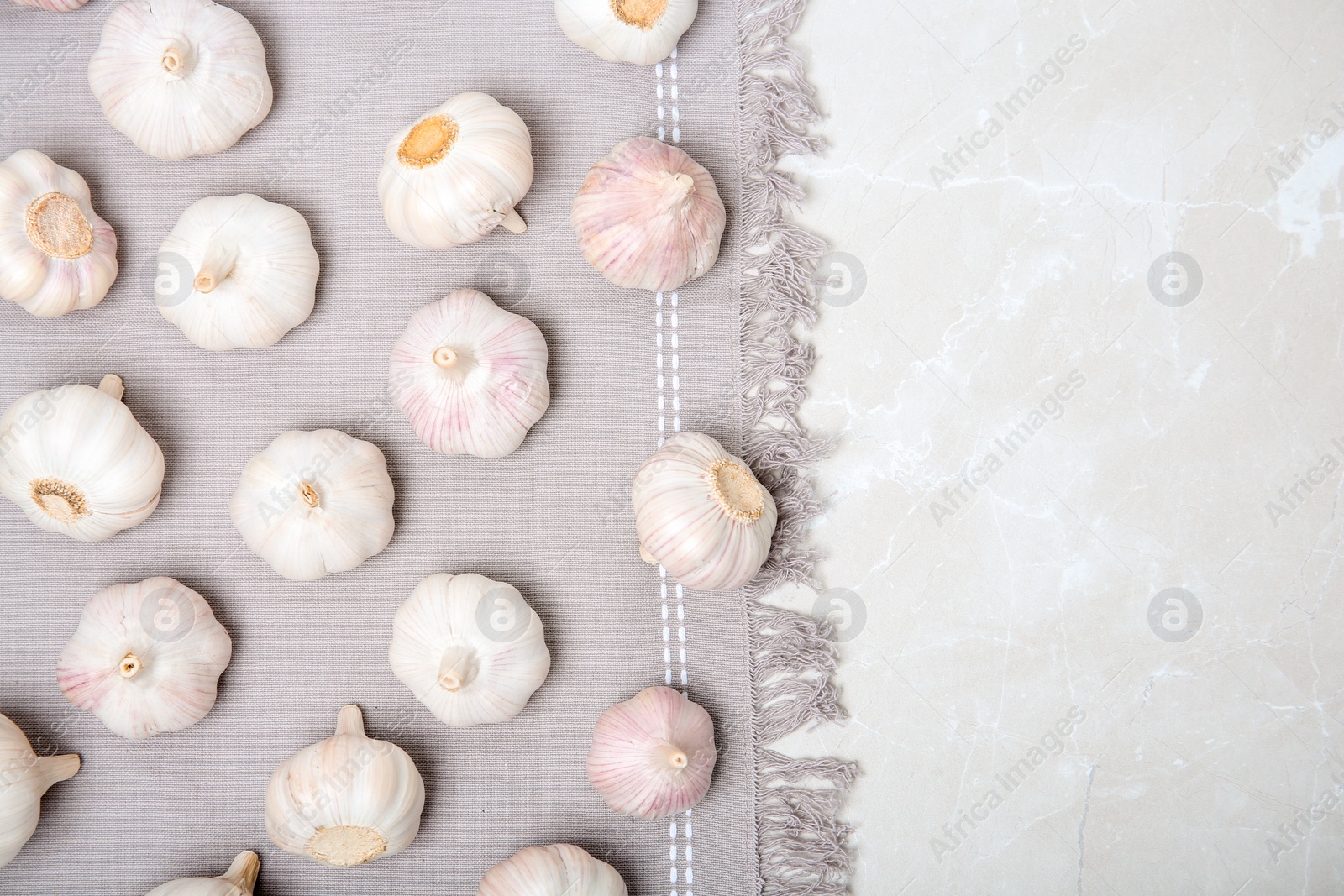 Photo of Flat lay composition with garlic on light background