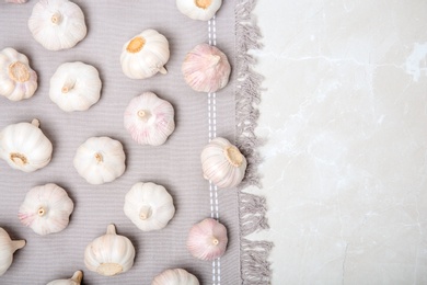 Flat lay composition with garlic on light background