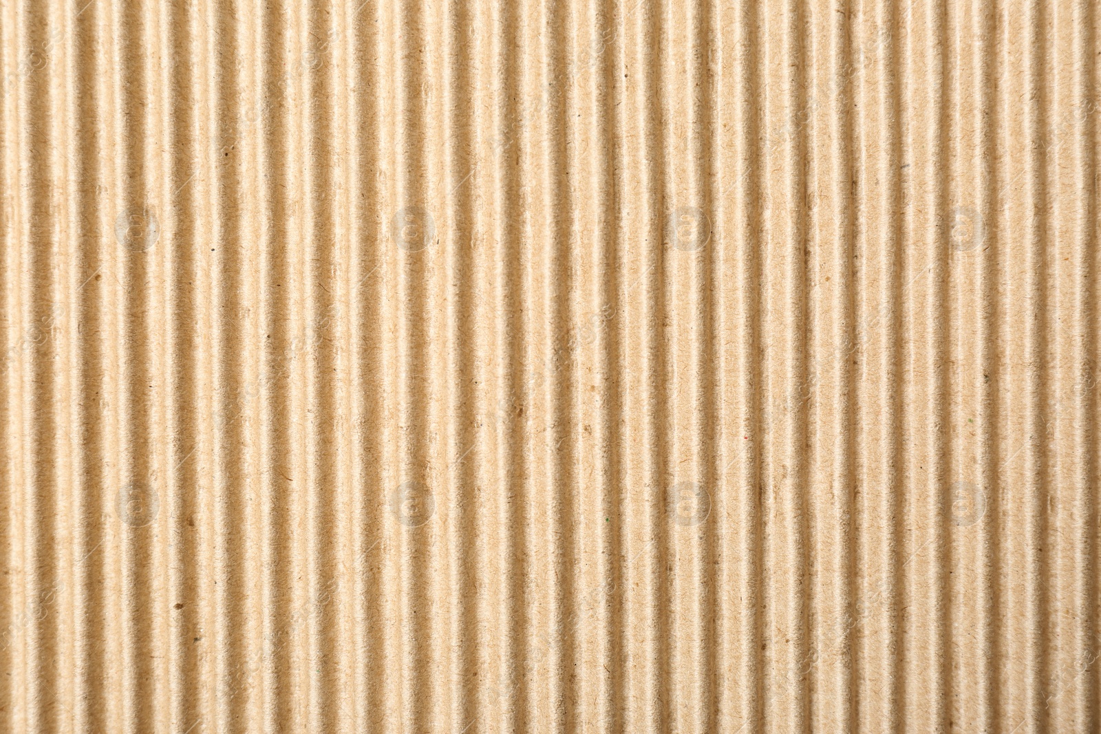 Photo of Corrugated cardboard surface as background, top view. Recyclable material