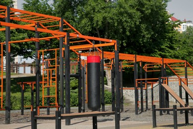 Photo of Empty outdoor gym with exercise equipment in park