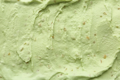 Delicious refreshing pistachio ice cream as background, closeup