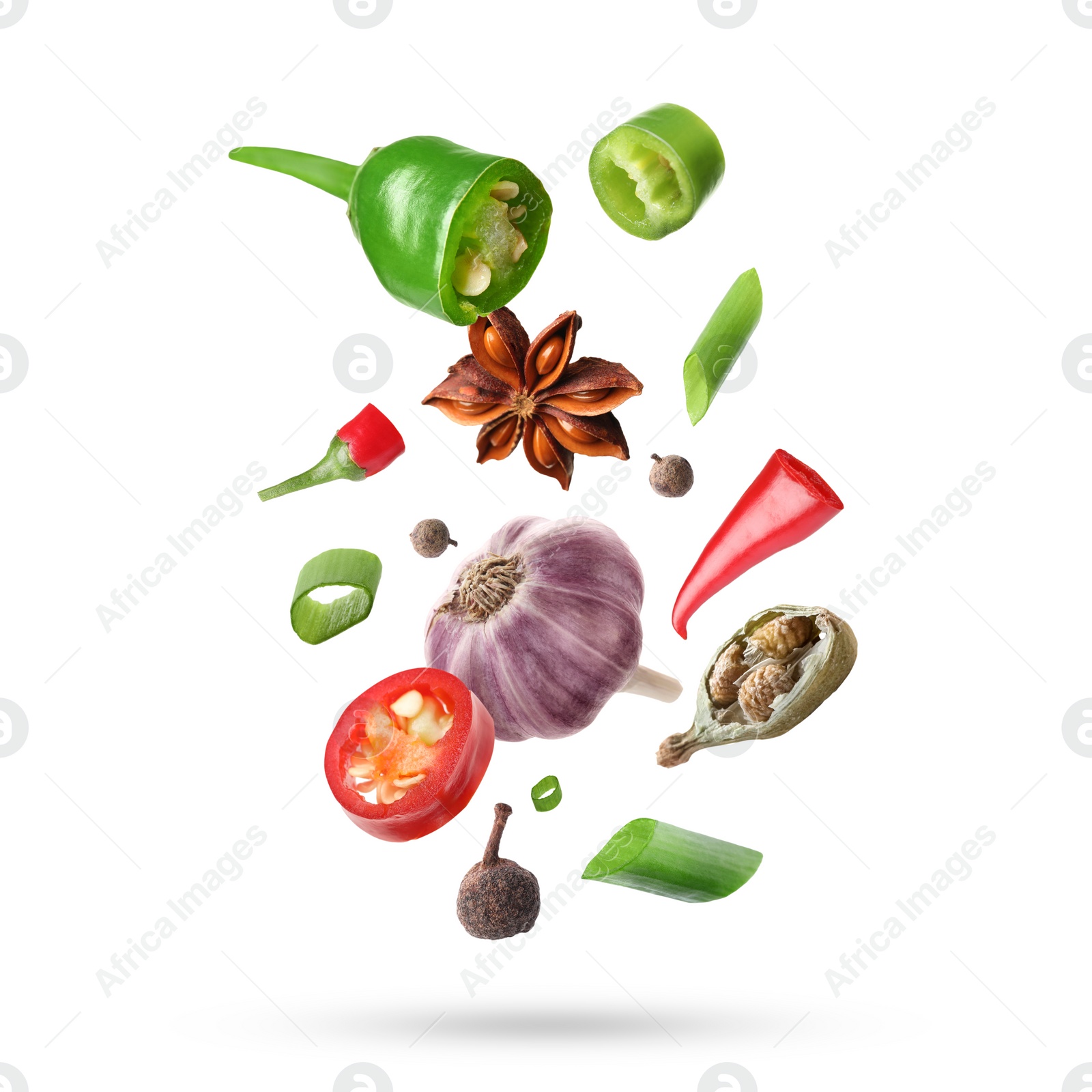 Image of Different aromatic spices falling on white background