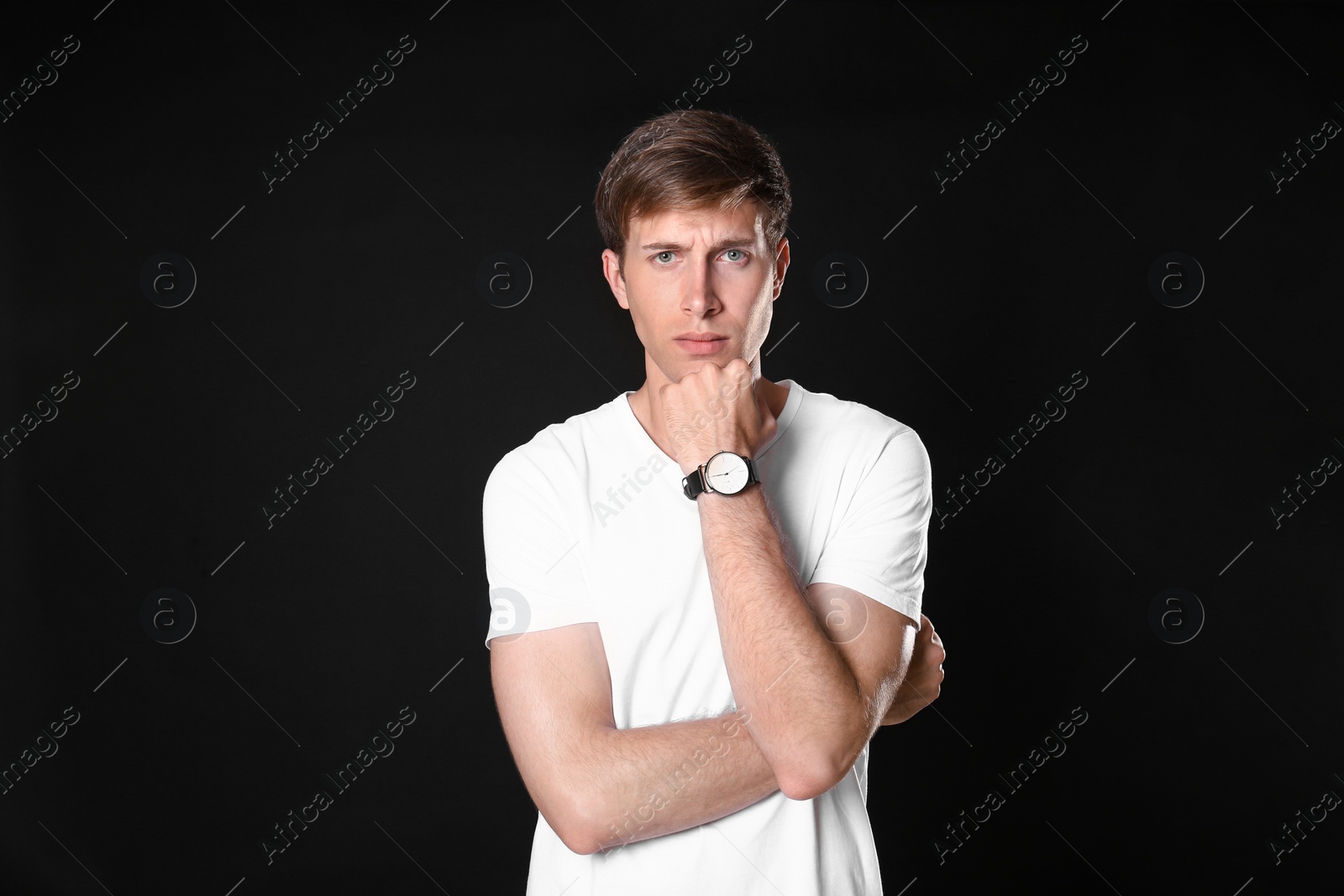 Photo of Portrait of handsome man on black background