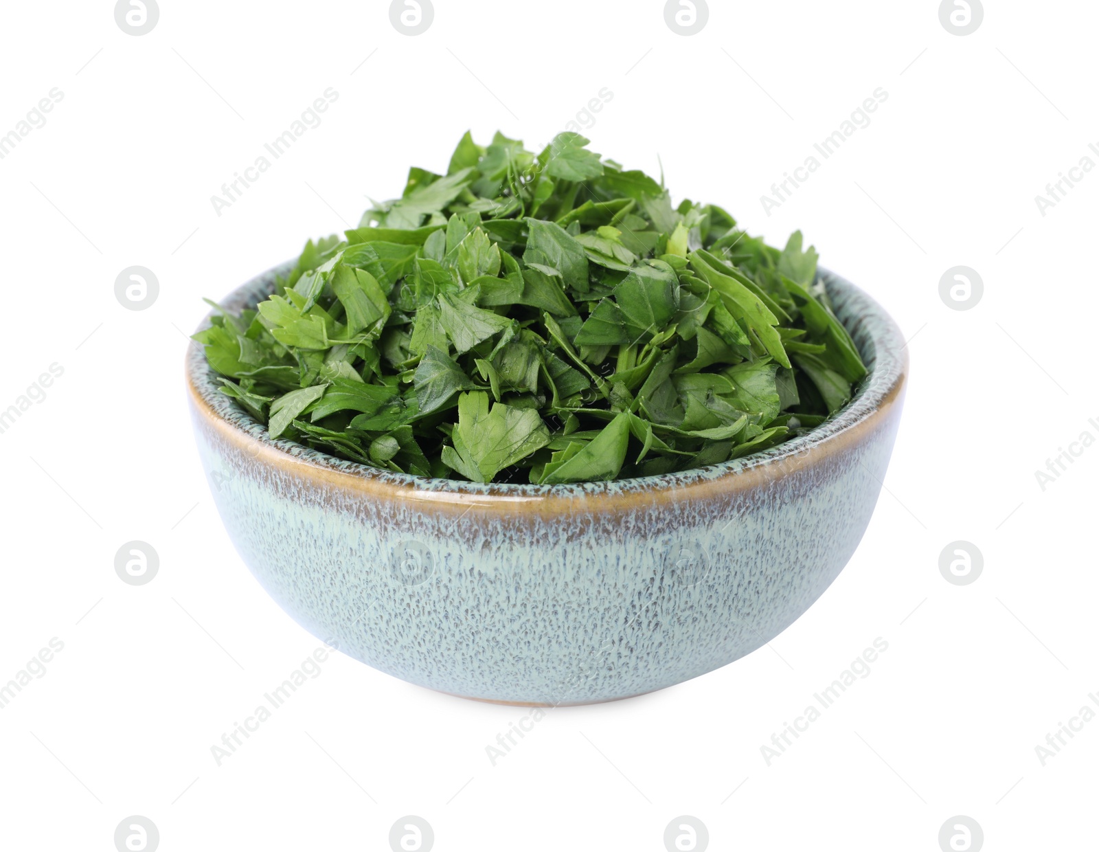 Chopped parsley leaves in bowl isolated on white Photo of Chopped parsley leaves in bowl isolated on white