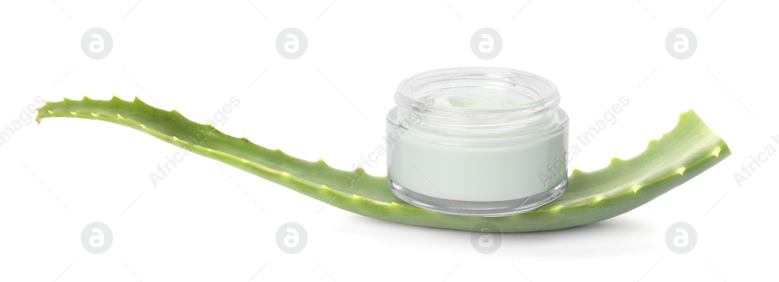 Photo of Jar of natural cream and aloe leaf isolated on white