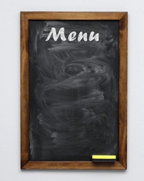 Image of Black chalkboard with word Menu on white background. Mockup for design